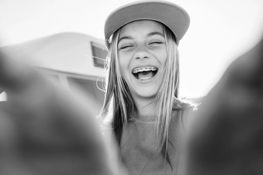 beautiful teen girl taking selfies in a yellow cap utc scaled x