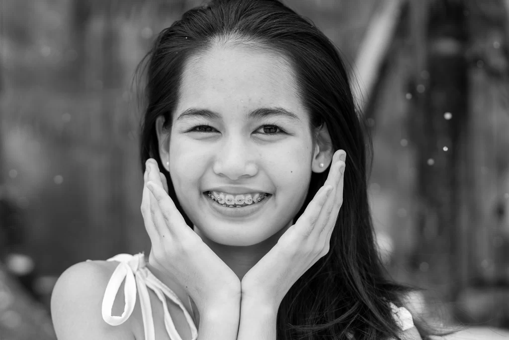 young female beautiful smile with braces close up utc x